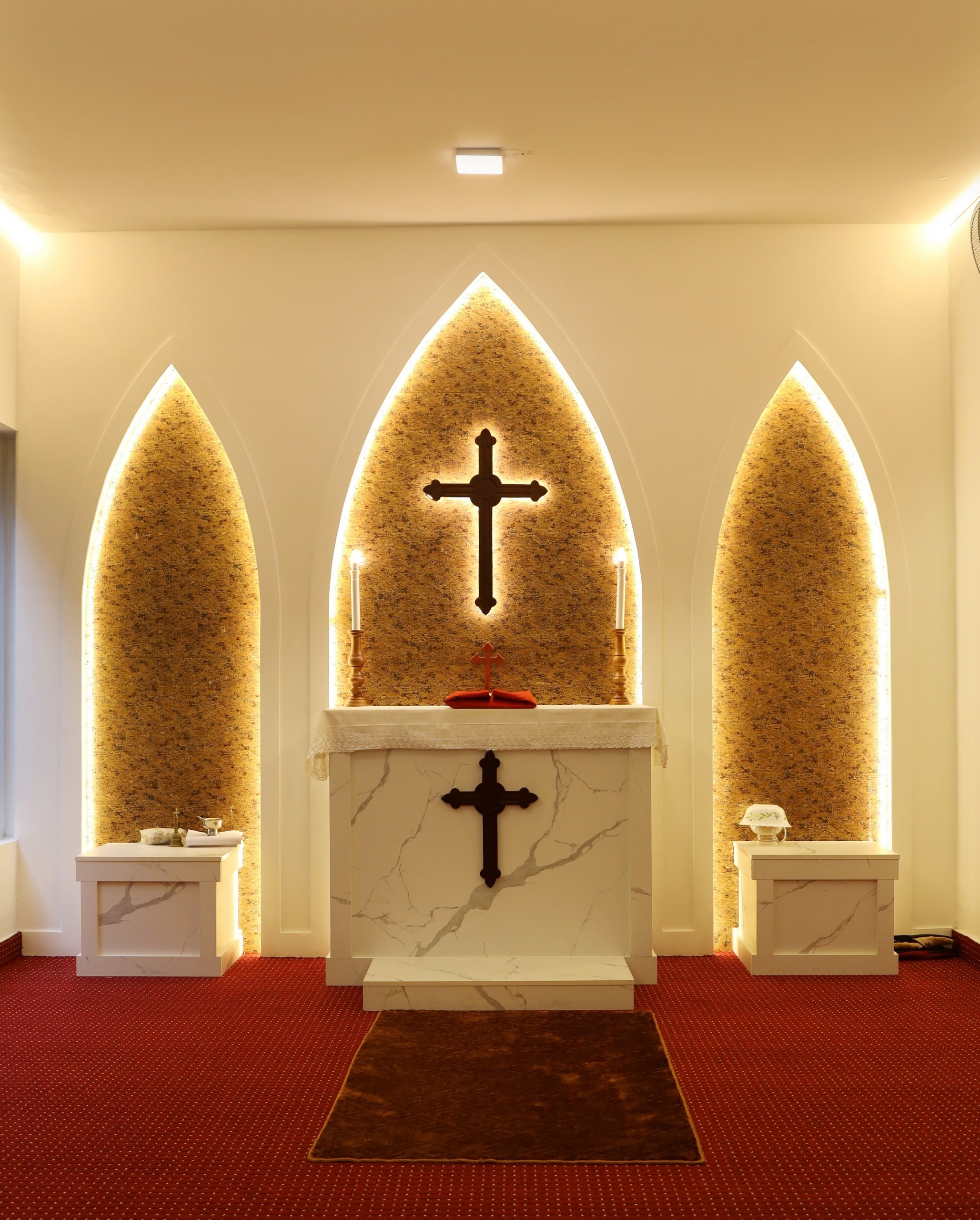 In-house chapel altar with triple arches