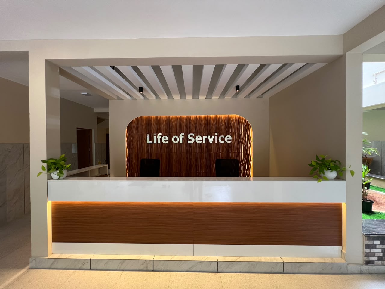 Life of Service reception lobby with centre wordmark